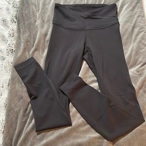 Black Lululemon cross waist leggings; size 4
